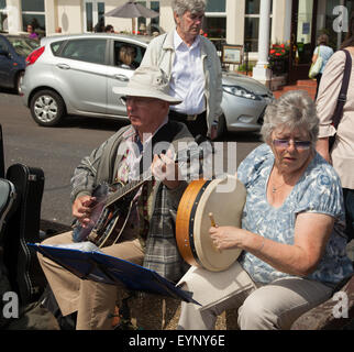 Sidmouth, Devon, UK. 2nd Aug, 2015. Buskers on the Espalanade during Sidmouth Folk Week, whicj celebrates music and dance from 31st July to 7th August. The event has been going since 1955 and takes place during the first week of August. Photo Tony Charnock, Alamy Live News Stock Photo