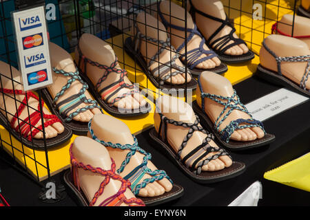 Rope sandals for sale on a street stall in Sidmouth, Devon, UK, during Folk Week Festival Stock Photo