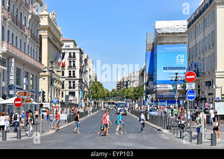 La Canebiere major shopping & historic high street in old quarter of Marseille viewed from Old Port Vieux Port Marseilles Provence South of France EU Stock Photo