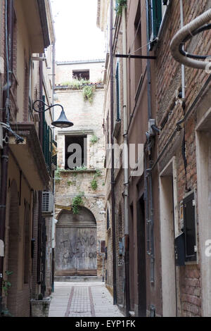 Graffiti painted on a wooden door in a laneway. Stock Photo