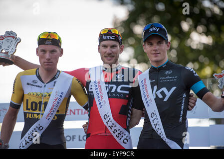 London, UK. 02nd Aug, 2015. Mike Teunissen (Team Lotto NL-Jumbo) (left), Jean Pierre Drucker (BMC Racing Team) (centre) and Ben Swift (right) react on the podium following the Prudential RideLondon-Surrey Classic at Horse Guards Parade, London, United Kingdom on 2 August 2015. The race started at Horse Guards Parade and finished on The Mall after a 200km route around Surrey and Greater London. Credit:  Andrew Peat/Alamy Live News Stock Photo