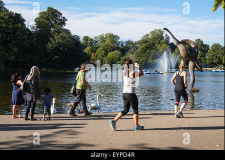 Londoners enjoying sunny afternoon in Victoria Park, London England United Kingdom UK Stock Photo