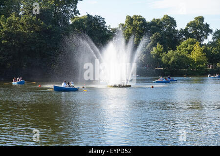 Londoners enjoying sunny afternoon in Victoria Park, London England United Kingdom UK Stock Photo