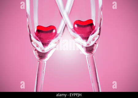 Red jelly hearts in champagne flutes, grey background Stock Photo