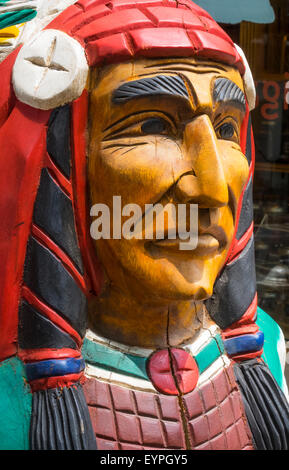 A wooden cigar store Indian carving outside a tobacco shop in Soho in New York City Stock Photo