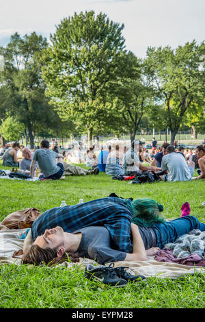 Couple sleeping on the grass, in Montreal Stock Photo