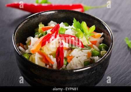 Rice and  vegetables on  black table. Selective focus Stock Photo