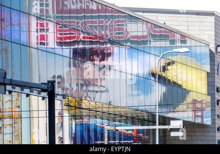 Tallinn, Estonia. 1st Aug, 2015. Pixels and Mission Impossible - Rogue Nation movies billboards on the Coca-Cola Plaza cinema in Tallinn. Pac-Man and Tom Cruise, Jeremy Renner, Simon Pegg, Rebecca Ferguson, Ving Rhames and Alec Baldwin are seen in the billboards. Credit:  Sergey Hmelevskih/Alamy Live News Stock Photo