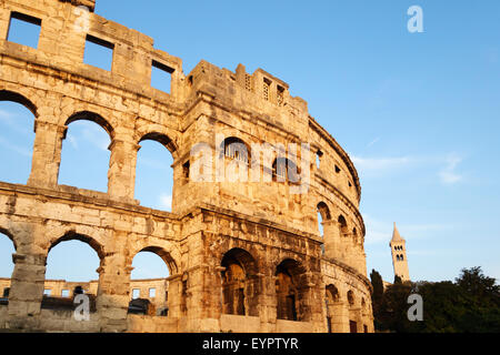 Pula, Istria, Croatia. The Pula Arena, a Roman amphitheatre built between 27BC - 68AD. St Anthony's Church in the background Stock Photo