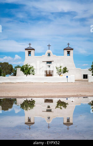 The St. Augustine Church reflected in a pool of water in the Pueblo of Isleta, New Mexico, USA. Stock Photo