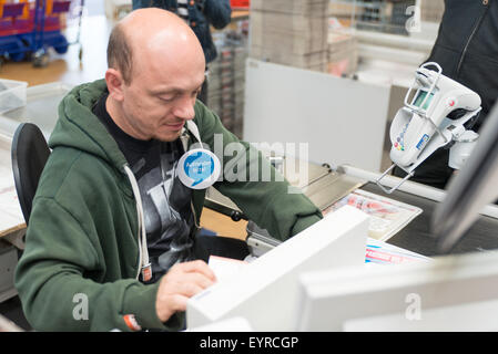 Bernhard Hoecker behind the counter during 'Woche des Aufrundens' by children's charity Deutschland rundet auf at toom Baumarkt  Featuring: Bernhard Hoecker Where: Berlin, Germany When: 02 Jun 2015 C Stock Photo