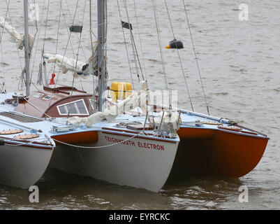 A replica of the boat used by Donald Crowhurst to compete in the 1968 Golden Globe Race moored in Teignmouth harbour to be used in the film being made about his life  Featuring: Teignmouth Electron Where: Devon, United Kingdom When: 02 Jun 2015 C Stock Photo