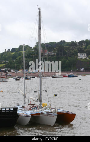 A replica of the boat used by Donald Crowhurst to compete in the 1968 Golden Globe Race moored in Teignmouth harbour to be used in the film being made about his life  Featuring: Teignmouth Electron Where: Devon, United Kingdom When: 02 Jun 2015 C Stock Photo