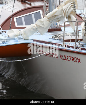 A replica of the boat used by Donald Crowhurst to compete in the 1968 Golden Globe Race moored in Teignmouth harbour to be used in the film being made about his life  Featuring: Teignmouth Electron Where: Devon, United Kingdom When: 02 Jun 2015 C Stock Photo