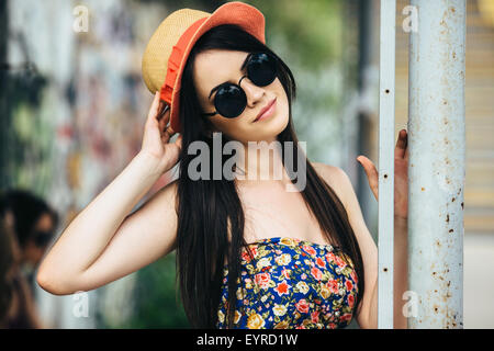 beautiful girl poses for camera in the city Stock Photo