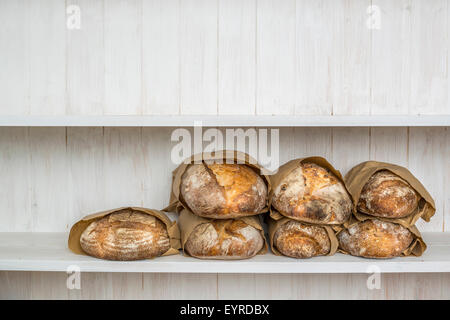 Various traditionally made sourdough breads in a bakery, Devon UK Stock Photo