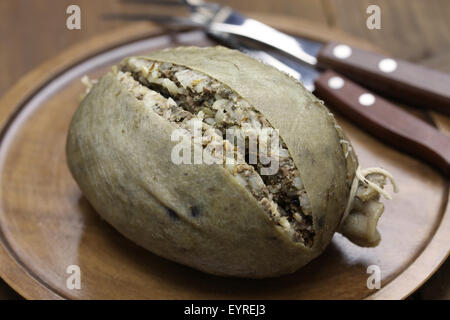 homemade haggis, scotland food isolated on wooden background
