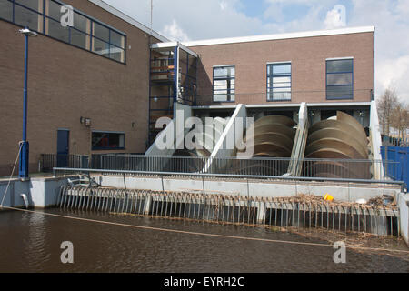 Pump house with big screws for watermanagement in the Netherlands Stock Photo