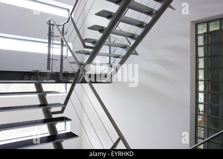 Emergency exit by a stairwell in a modern building Stock Photo