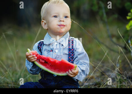 little boy eats watermelon Stock Photo