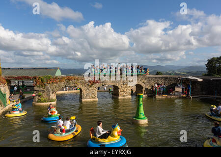 Montana Suiza roller coaster and duck boats ride in the amusement park on top of Monte Igueldo. Stock Photo