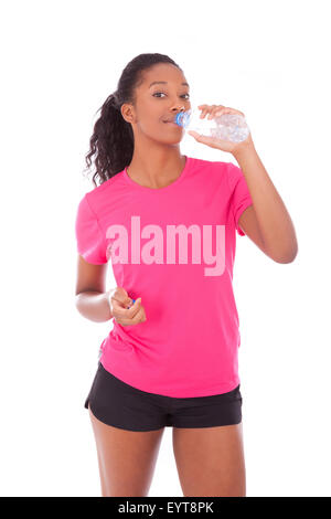 Young african american jogger woman drinking water, isolated on white background Stock Photo