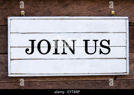 Join Us Inspirational message written on vintage wooden board. Motivation concept image Stock Photo