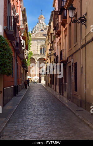 Cobblestone street of Santo Domingo leading to the ancient church and statue of Friar Louis of Granada Spain Stock Photo