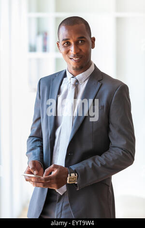 Portrait of a young African American business man using a mobile phone - Black people Stock Photo