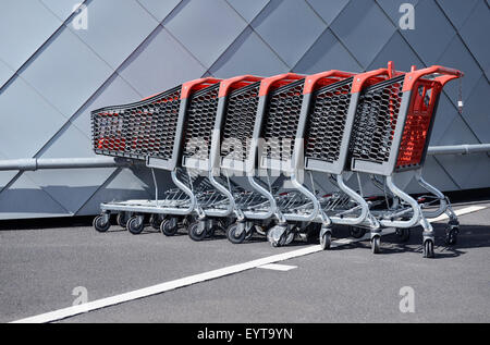 Row of modern plastic shopping trolleys, Germany, North Rhine-Westphalia, Neuss Stock Photo