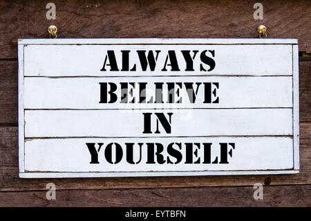 Always Believe In Yourself Inspirational message written on vintage wooden board. Motivation concept image Stock Photo