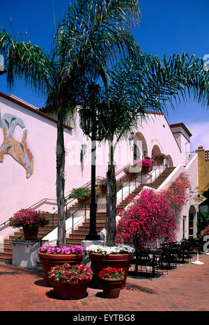 Santa Barbara, California, USA - Center Stage Theater and Outdoor Restaurant Patio in a Courtyard with Palm Trees and Flowers Stock Photo