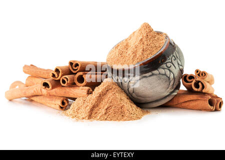 cinnamon sticks with powder isolated on white background. Stock Photo