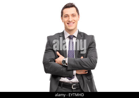 Confident young businessman in a gray suit looking at the camera isolated on white background Stock Photo