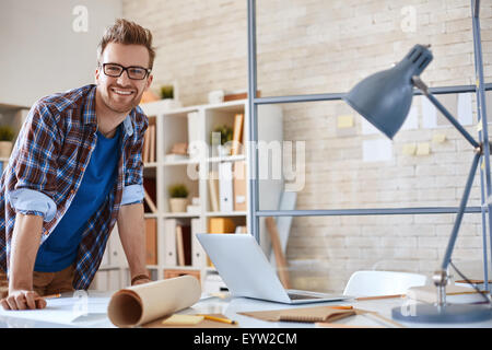 Contemporary engineer looking at camera with smile Stock Photo
