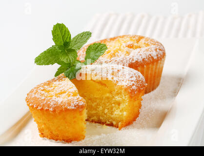 Custard filled muffins on plate Stock Photo