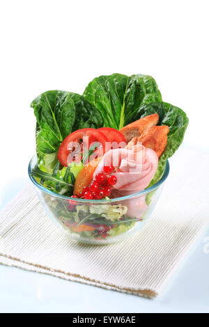 Fresh vegetable salad with ham and crostini Stock Photo