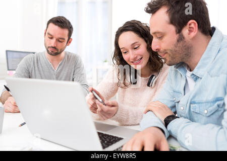 View of Students working together on a report Stock Photo