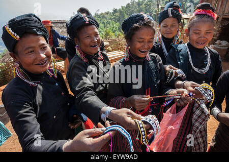 Native woman in typical clothing from the Ann tribe in a mountain village at Pin ropek, offering homemade handicrafts Stock Photo