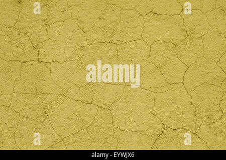 yellow painted cracked wall background texture Stock Photo