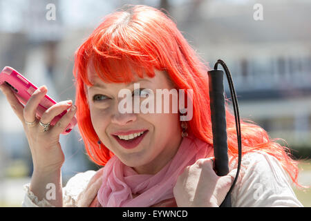 Blind woman using her assistive technology to listen to her texts Stock Photo