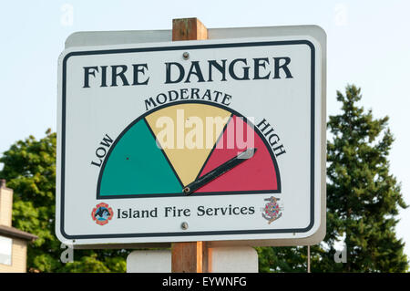 A sign in Friday Harbor on San Juan Island warns of a high risk of fire due to hot summer weather. Stock Photo