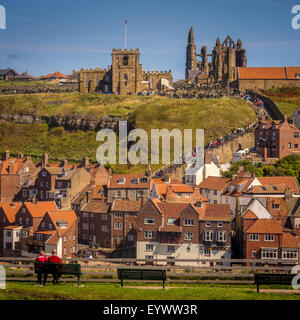 St Mary's Church and Whitby Abbey with riverside buildings in the foreground. Whitby, North Yorkshire. Stock Photo