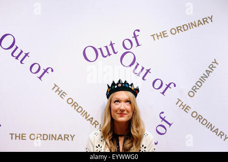 London, UK. 3rd August, 2015. Christie's Head of Sale Kate Summers poses with a felt crown, designed by miliner Stephen Jones originally worn by model Kate Moss on her first magazine shoot in 1989, at Christie's Auction House in London, UK Monday 3, August 2015. The piece is expected to for £5000 when it comes to auction, as part of the Out of the Ordinary Sale on September 10. Credit:  Luke MacGregor/Alamy Live News Stock Photo