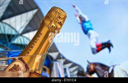 Royal Ascot Close up champagne bottle with Royal Ascot race winner Frankie Dettori jumping in celebration behind Ascot Berkshire UK Stock Photo