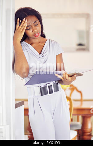 Ethnic woman working out finances Stock Photo