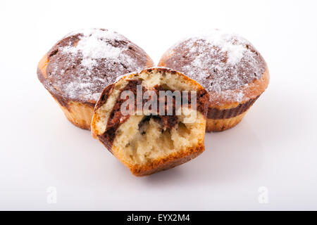 Three tasty freshly baked muffins, isolated Stock Photo