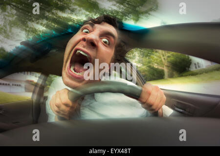 Silly man gets into car crash and makes ridiculous face Stock Photo