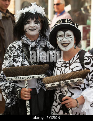 Sidmouth, Devon, UK. 4th Aug, 2015. Members of the Pig Dyke Molly dance troupe prepare for their performance in the Market Square during Sidmouth Folk Week. The folk festival in Sidmouth has been held since 1955, and is a premier event in the traditional music and dance calendar. Photo: Tony Charnock/Alamy Live News Stock Photo