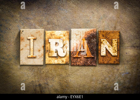 The word 'IRAN' written in rusty metal letterpress type on an old aged leather background. Stock Photo